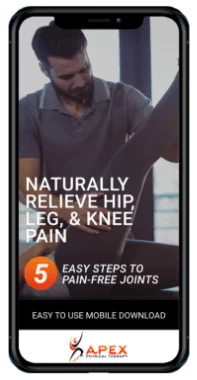 A man is holding his leg and knee